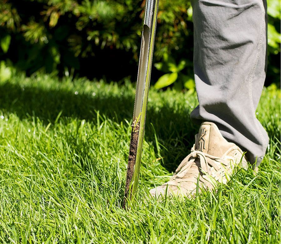 Man Performing Soil Test