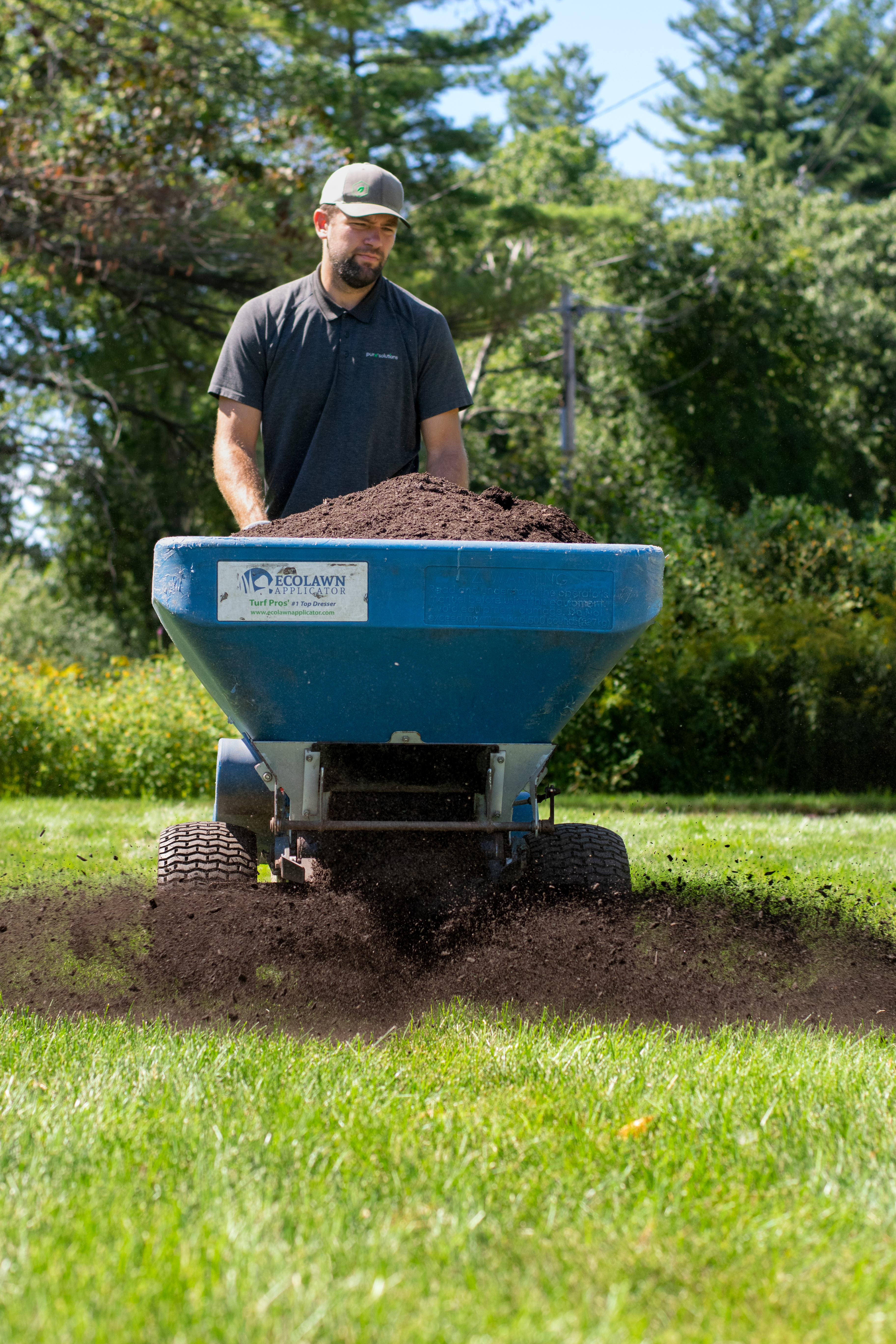 Organic fertilizer and compost used for fall lawn care and to support over-seeding germination