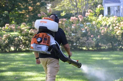 Pure Solutions service technician spraying for ticks